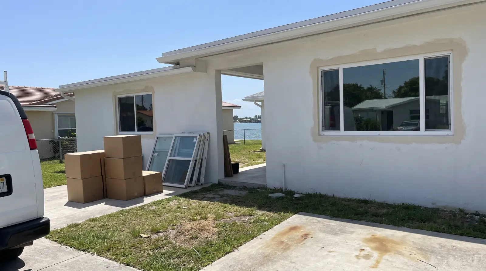 New impact windows on a mid-century home on the West Island of Bay Harbor Islands, FL
