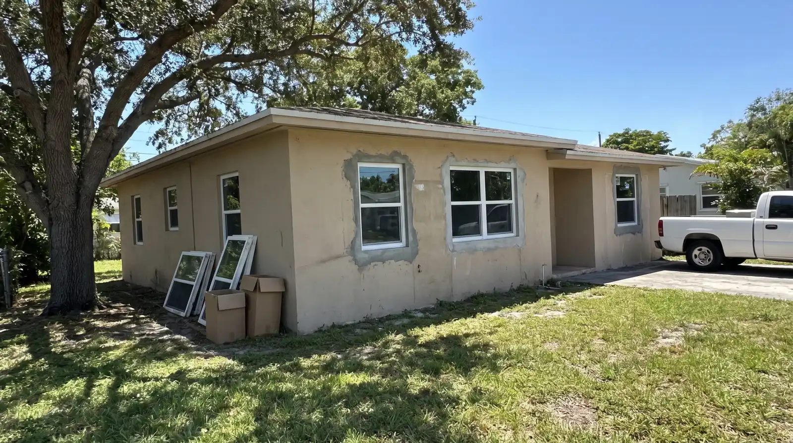 Impact windows on a 1940s single-family home in Biscayne Park, FL