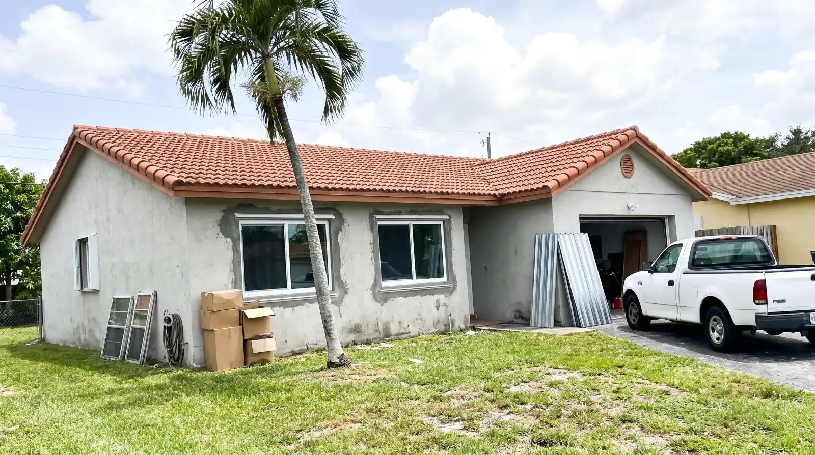 Impact windows on a 1980s single-family home in Cutler Bay, FL
