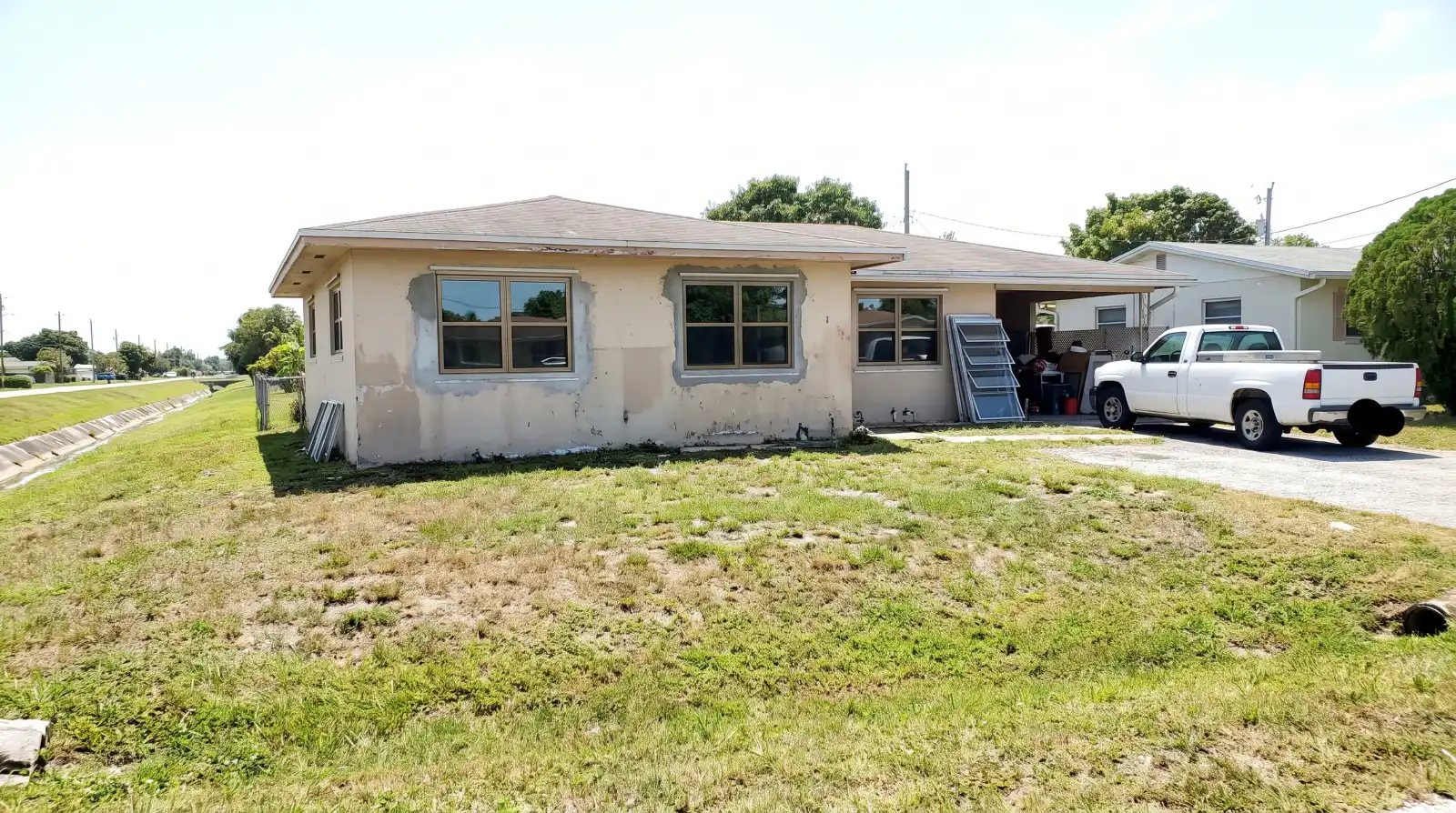 Impact windows on a 1950s block home in Glen Ridge, FL