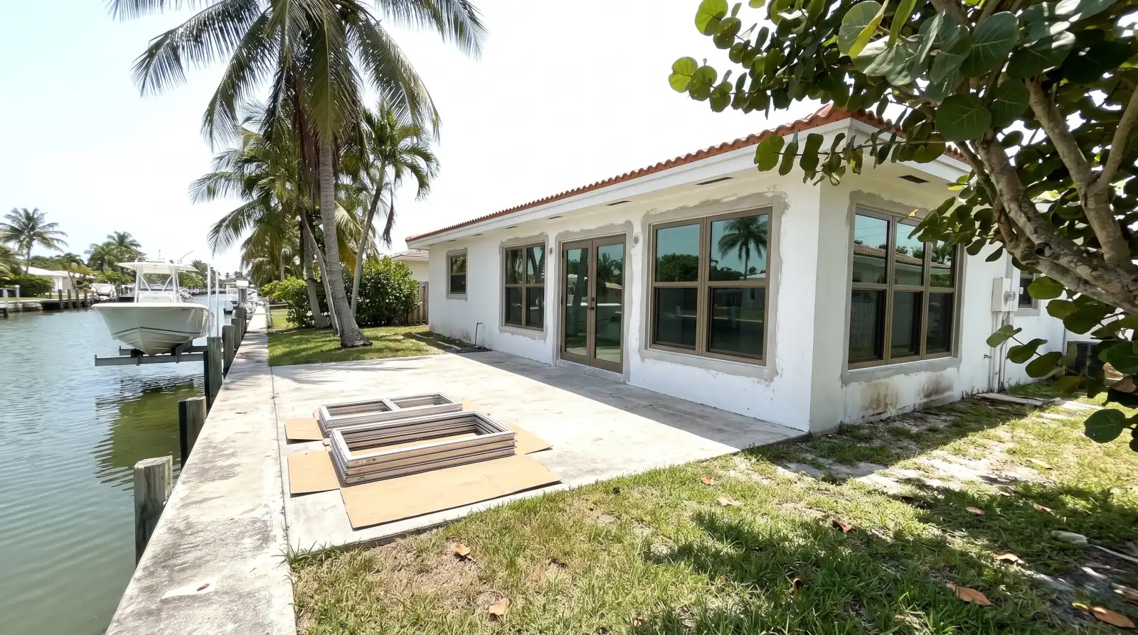 Impact windows on a canal-front home in Lighthouse Point, FL