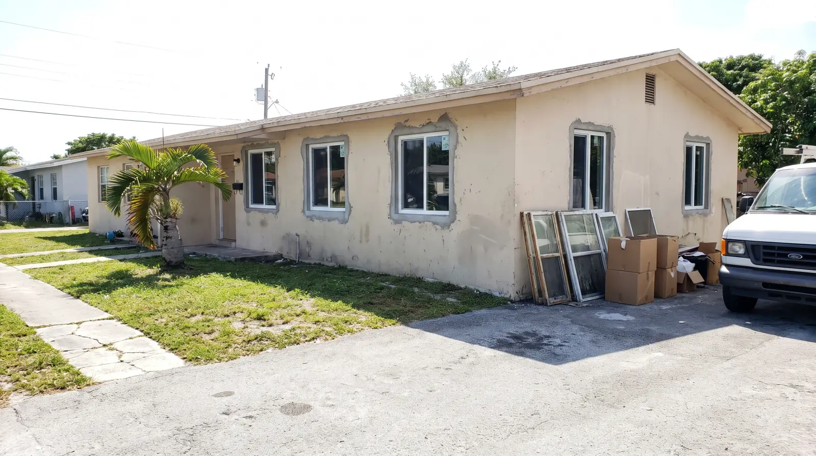 Impact windows on a concrete-block home in Opa-locka, FL