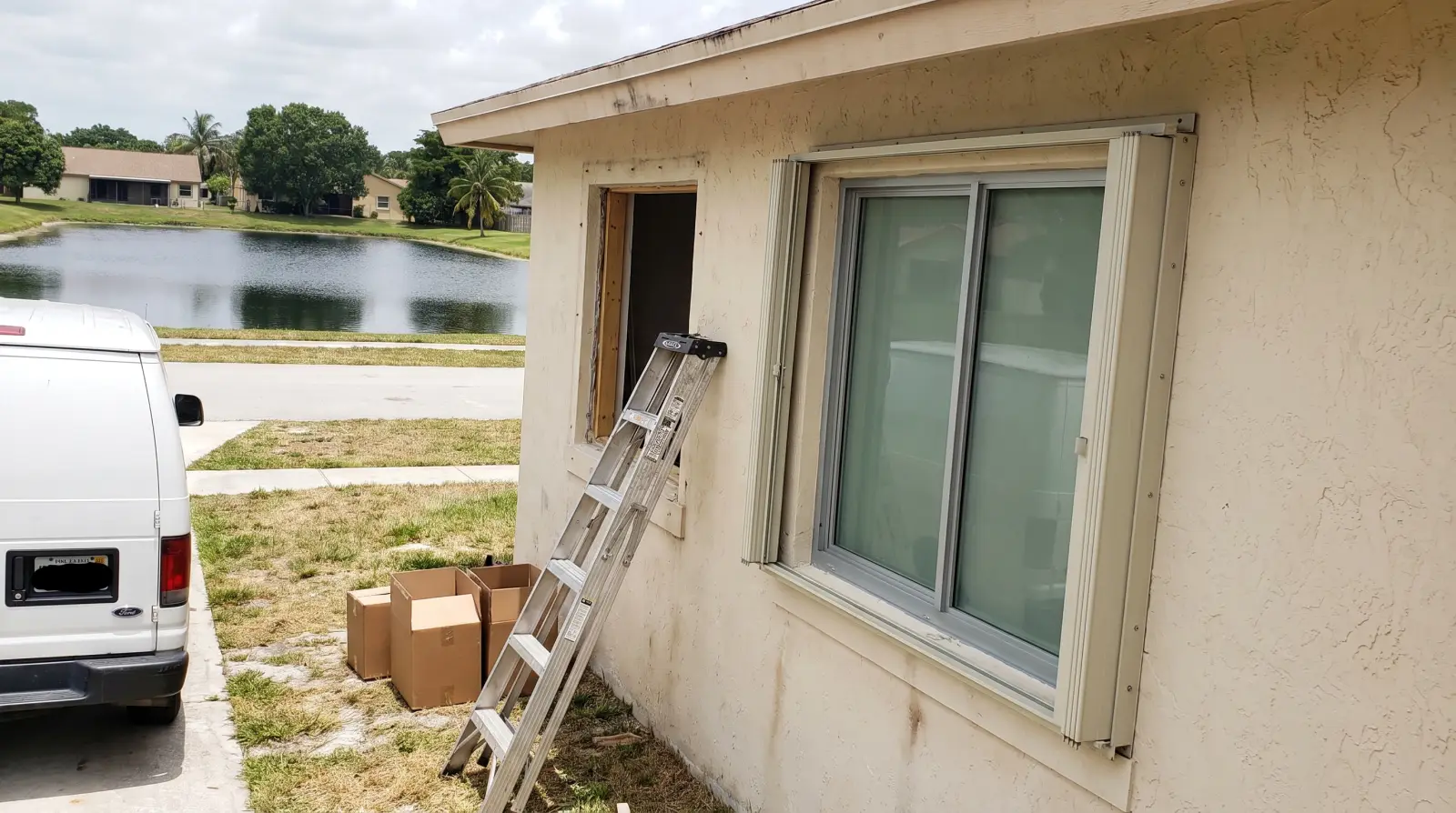Impact windows on a suburban single-family home in Royal Palm Beach, FL