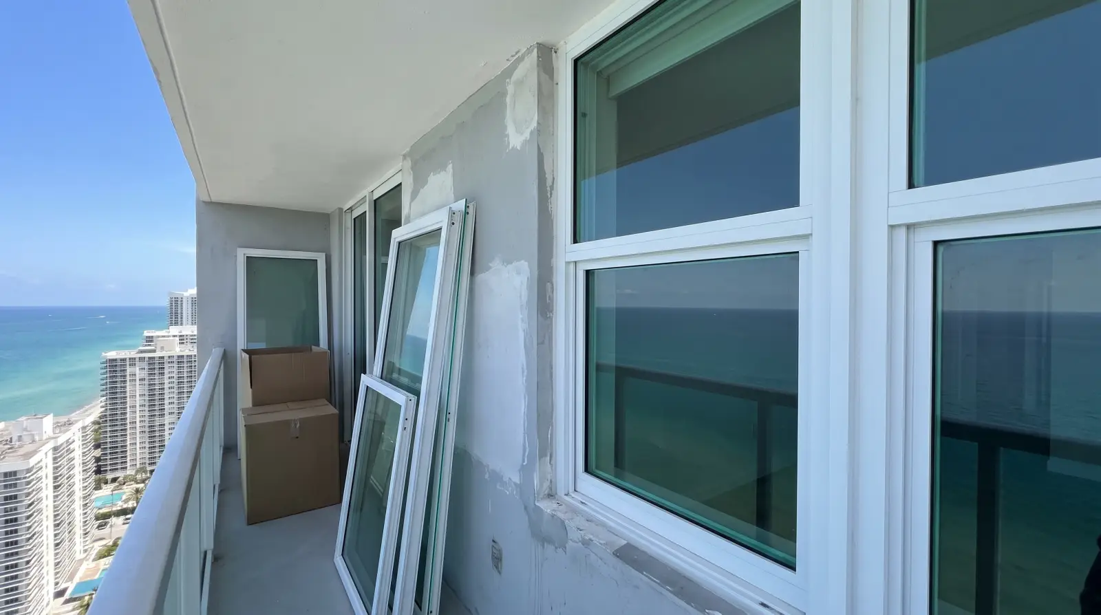Impact sliding glass doors on a high-rise condo balcony in Sunny Isles Beach, FL