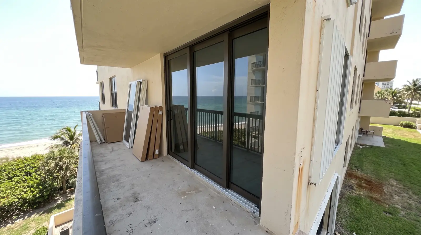Impact sliding glass doors on an oceanfront condo balcony in Bal Harbour, FL