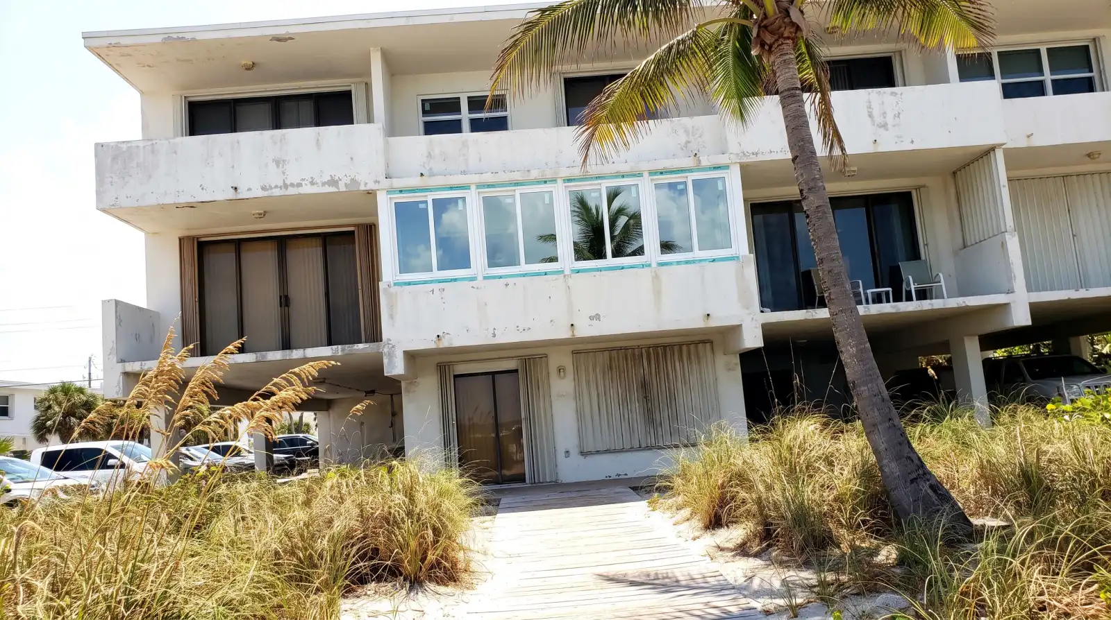 Impact windows being installed on a concrete-block home in Dania Beach, FL