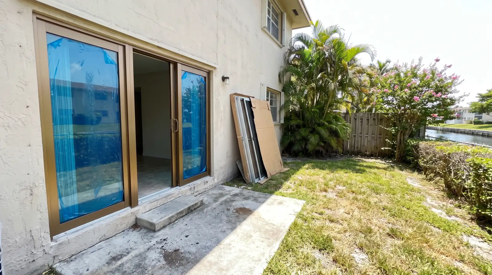 Impact sliding glass door opening onto a condo balcony in Hallandale Beach, FL