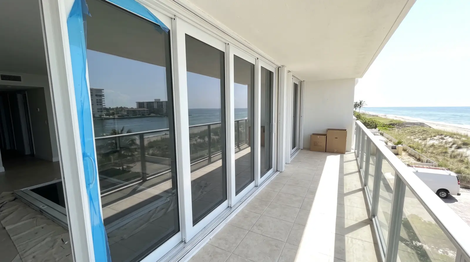 Impact sliding glass door on an oceanfront condo balcony in Hillsboro Beach, FL