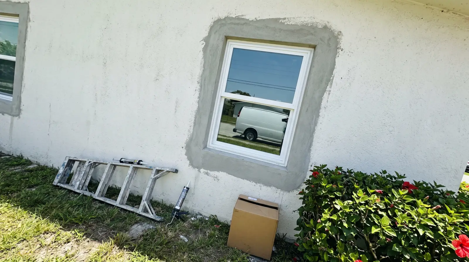 Impact windows being installed on a block home in Hollywood, FL
