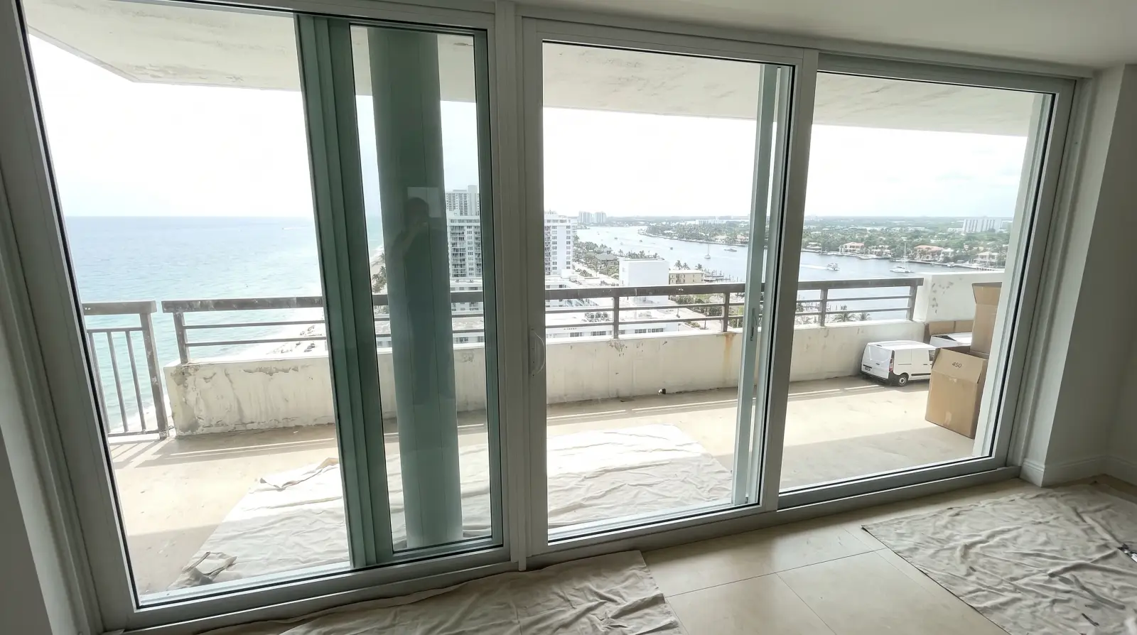 Impact sliding glass door opening onto a balcony near Hollywood Beach, FL