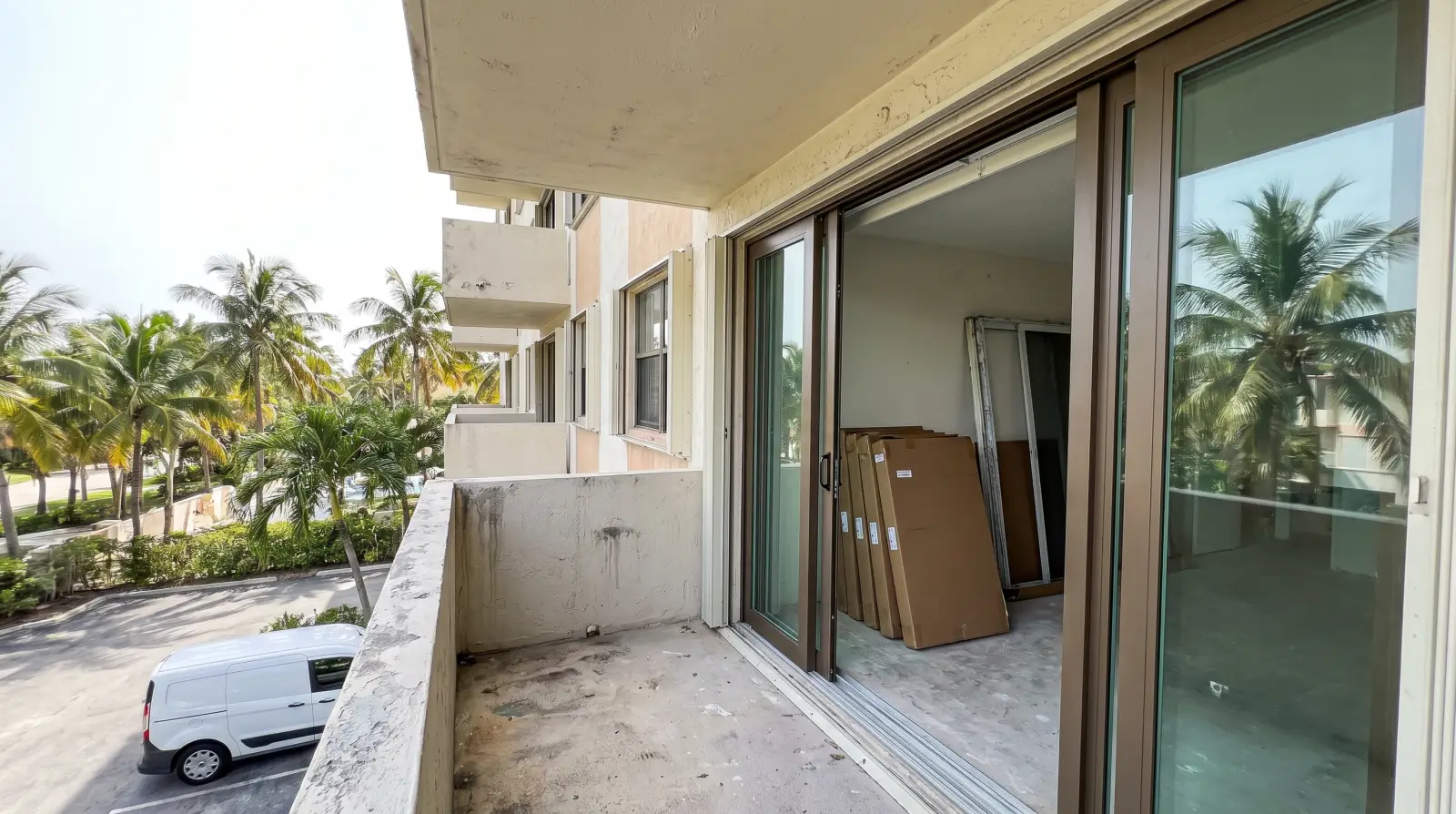 Impact sliding glass doors on an oceanfront condo balcony in Key Biscayne, FL