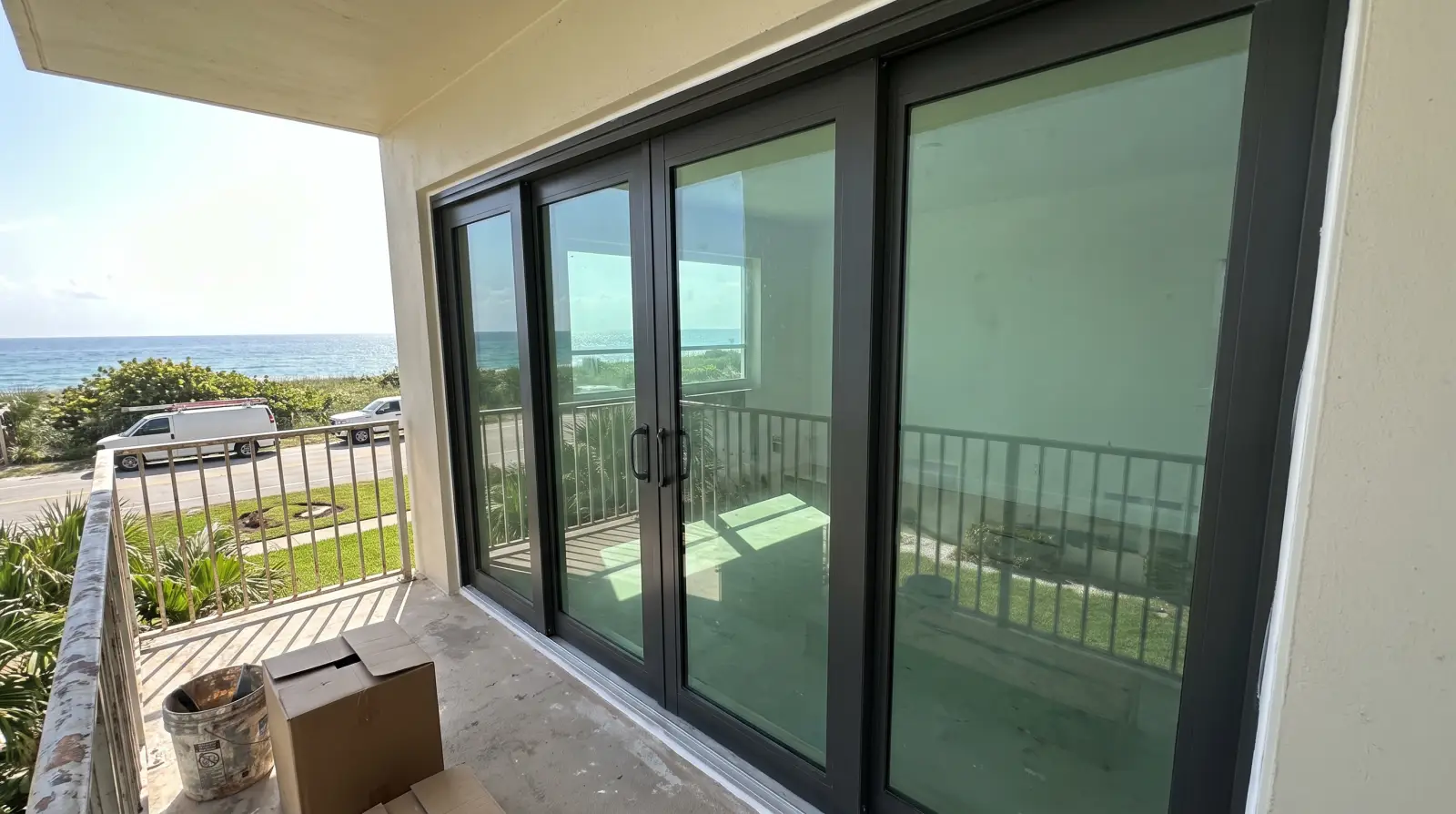 Impact sliding glass doors on a condo balcony in Palm Beach, FL