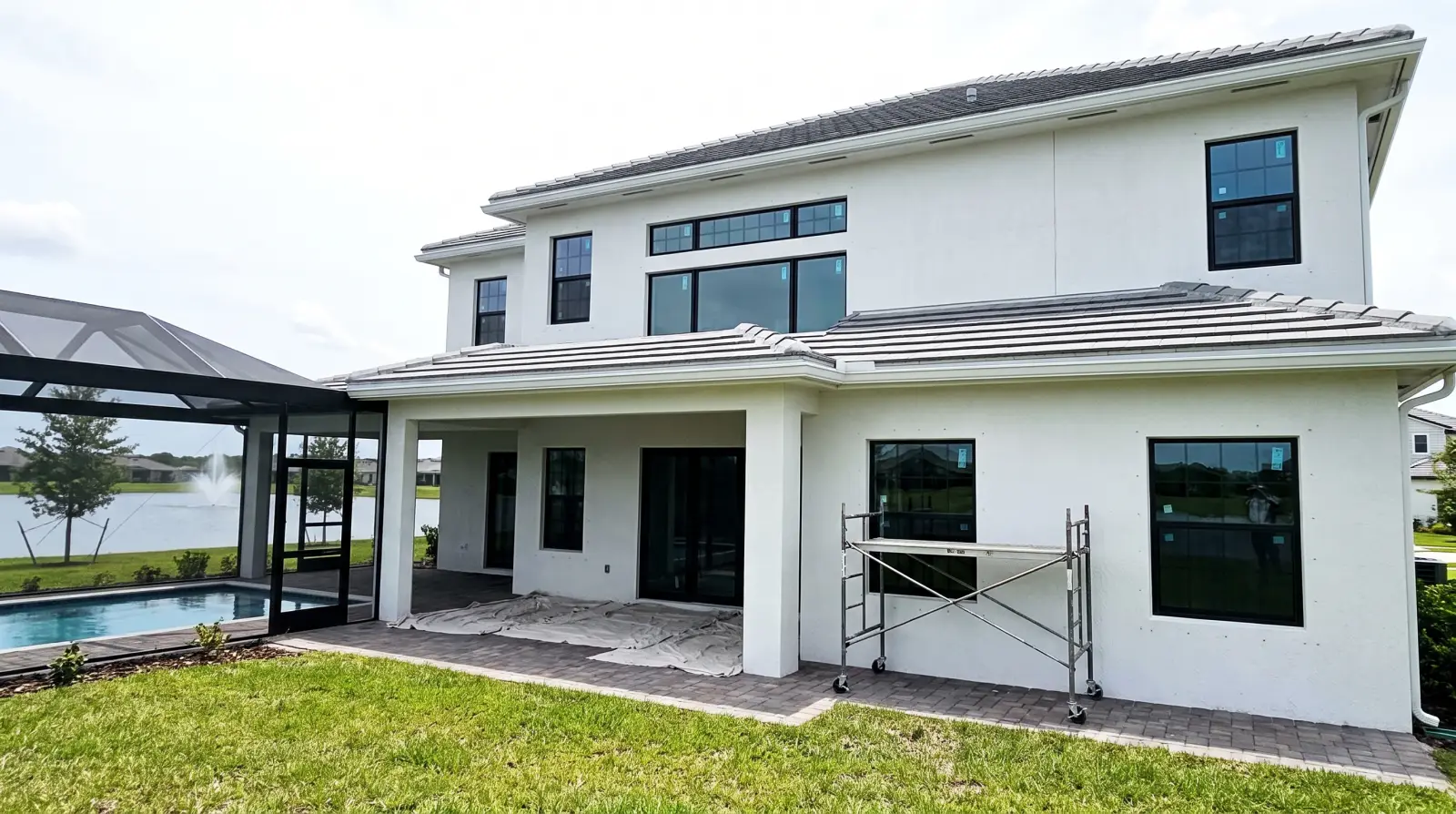 Impact windows being installed on a two-story home in Parkland, FL