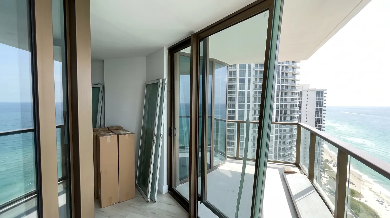 Impact sliding glass doors on a high-rise condo balcony in Sunny Isles Beach, FL