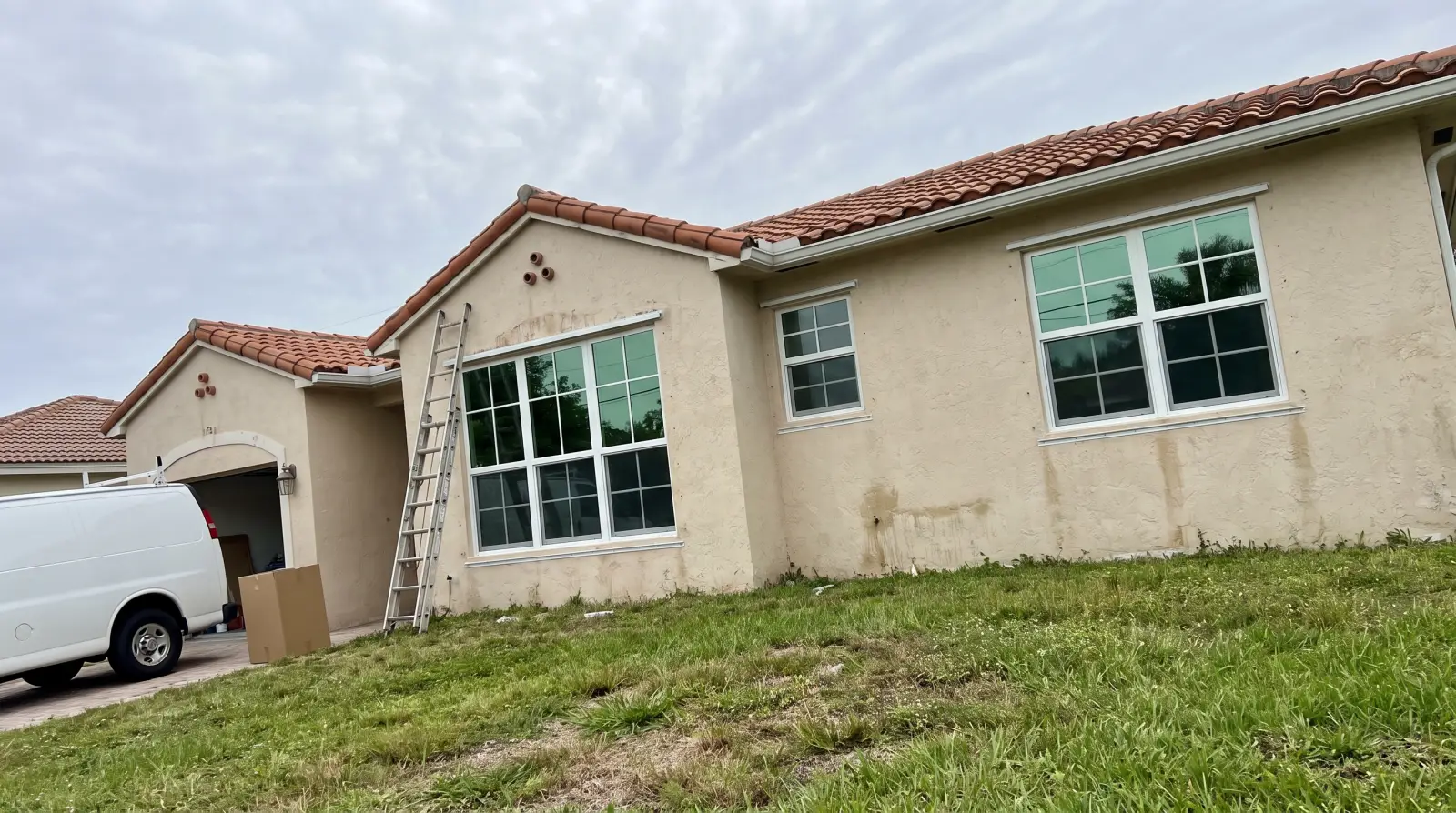 Impact windows on a Mediterranean Revival home in the El Cid district of West Palm Beach, FL