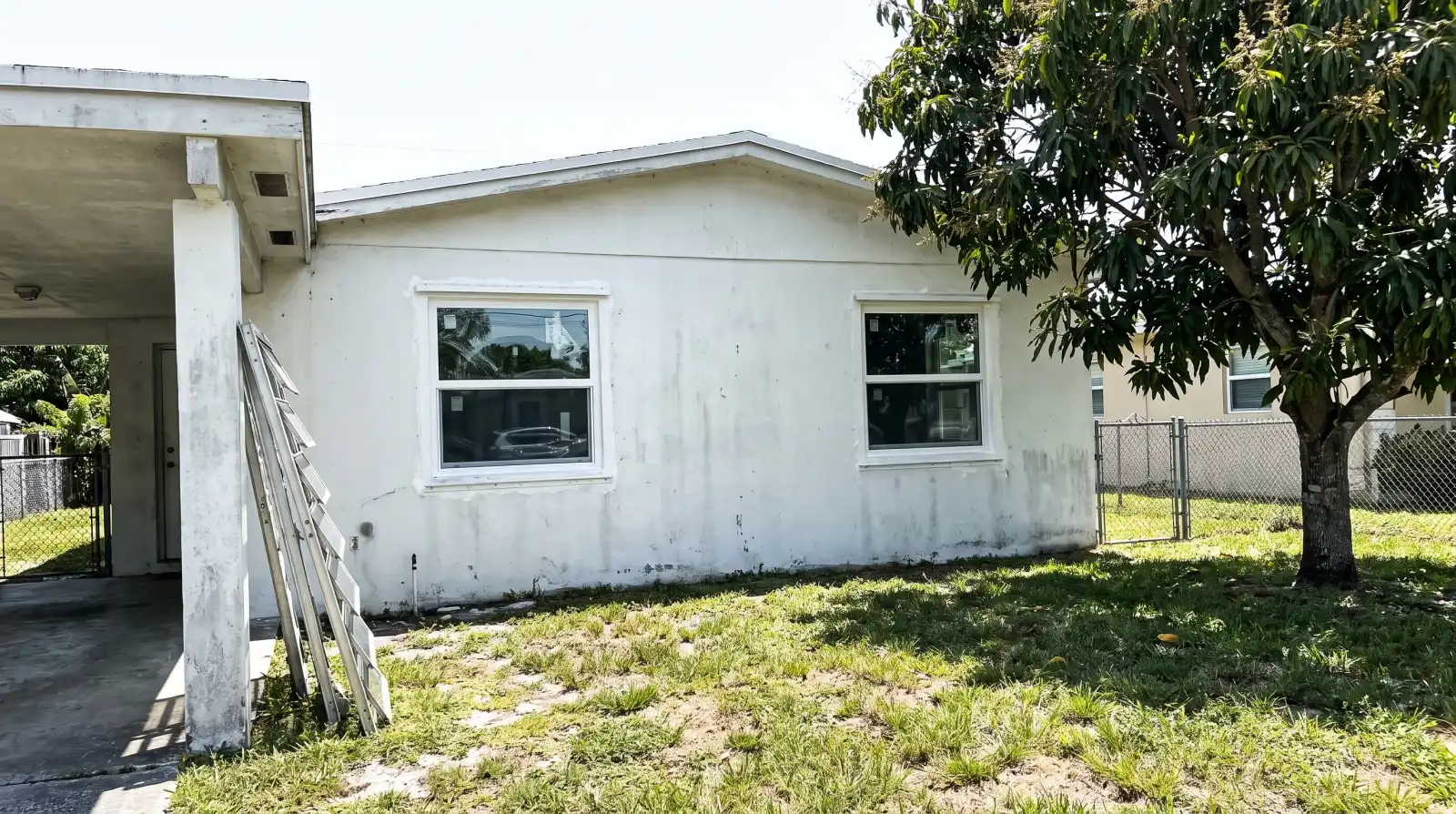 Impact windows being installed on a 1960s home in West Park, FL