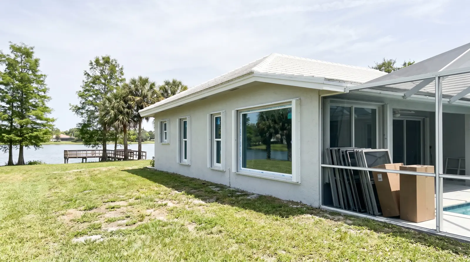 Impact windows being installed on a 1990s home in Weston, FL
