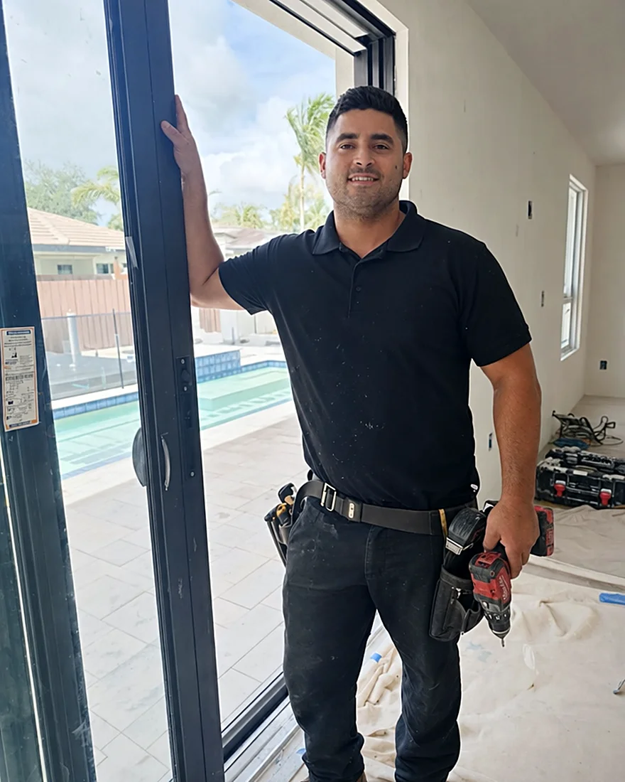 David Gallo installing an impact sliding glass door in a South Florida home